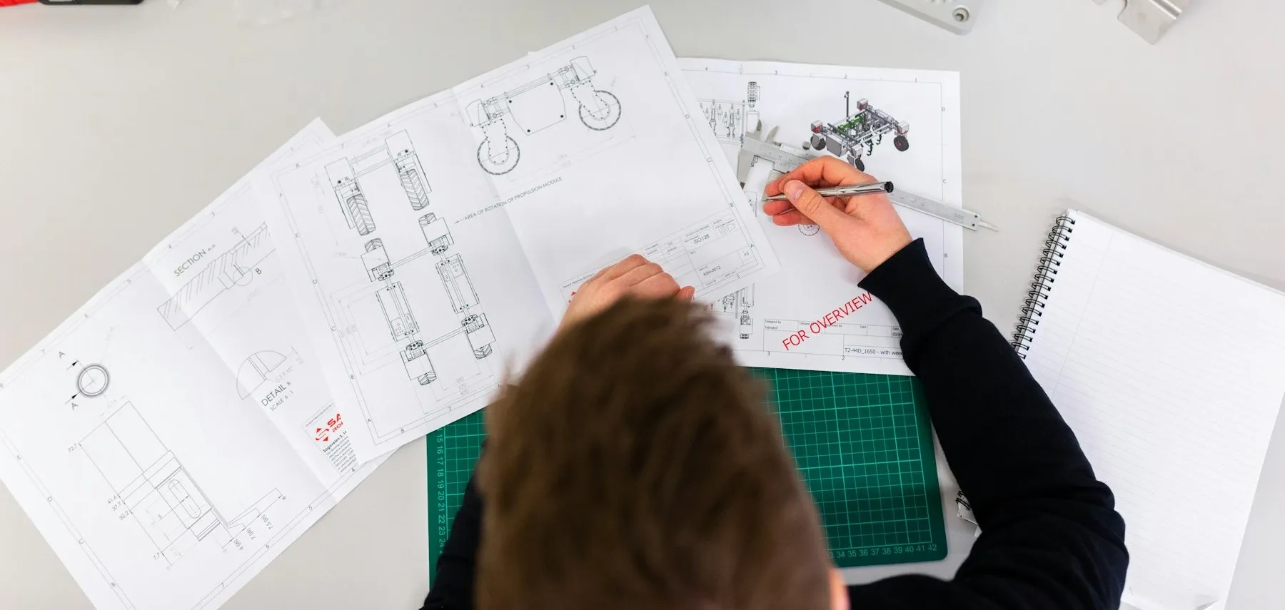 Technical engineering drawings being measured